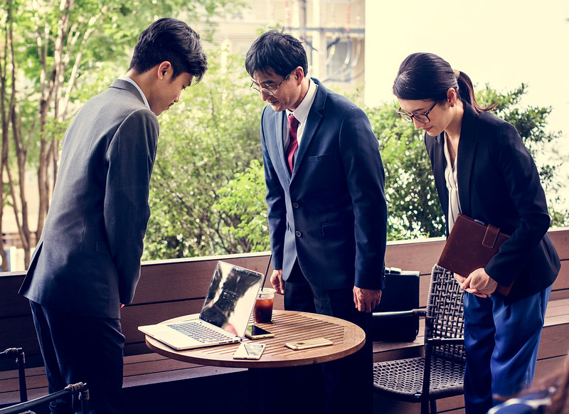 Business people bowing